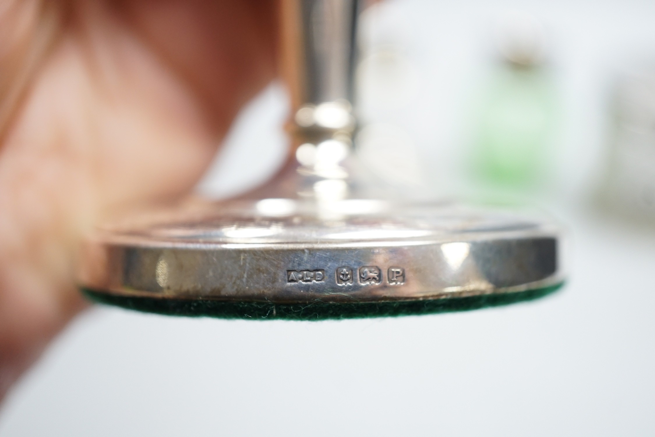 A pair of mid 20th century silver mounted dwarf candlesticks, 92mm, a silver mounted glass jar and a green glass vase.